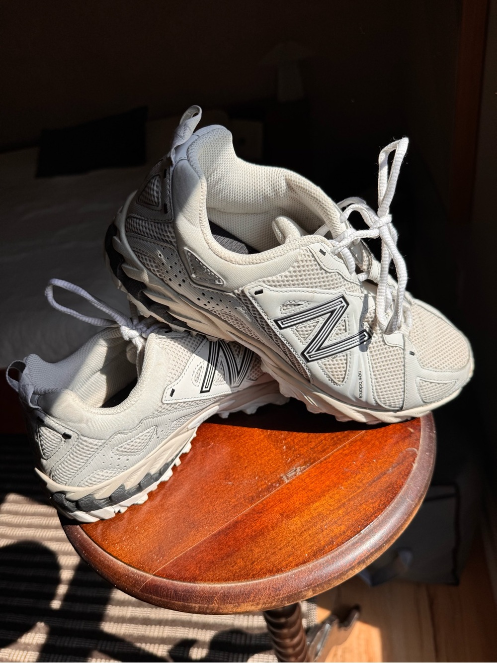 New Balance womenโs Gray and White Trail Sneakers